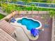 Backyard oasis featuring a sparkling pool, beautiful landscaping, and lounge area for relaxation and enjoyment at 835 E Virgo Pl, Chandler, AZ 85249