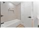 Bathroom features a shower-tub combo and a modern tile surround at 8419 N 51St Dr, Glendale, AZ 85302