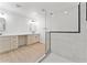 Bathroom featuring a tiled shower, vanity, and modern design at 8419 N 51St Dr, Glendale, AZ 85302