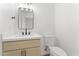 Bathroom with modern vanity, updated lighting, and a toilet at 8419 N 51St Dr, Glendale, AZ 85302