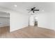 Bedroom with ceiling fan, closet, and bathroom access at 8419 N 51St Dr, Glendale, AZ 85302