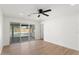 Bedroom with a ceiling fan, wood floors, and sliding glass door to backyard at 8419 N 51St Dr, Glendale, AZ 85302