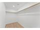 Walk in closet with wood floors and a closet rod at 8419 N 51St Dr, Glendale, AZ 85302
