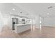 Bright kitchen boasts an island with barstool seating, stainless steel appliances, and an open floor plan at 8419 N 51St Dr, Glendale, AZ 85302