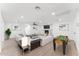 Bright living room features a fireplace, modern furnishings, and an adjacent foosball table at 8419 N 51St Dr, Glendale, AZ 85302
