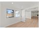 Bright living room with wood floors, fresh white paint, and natural light at 8419 N 51St Dr, Glendale, AZ 85302