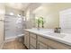Clean bathroom with a glass enclosed shower and plenty of vanity storage space at 9144 W Surrey Dr, Peoria, AZ 85381