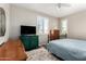 Cozy bedroom features a large bed, bright windows, and decorative accents at 9144 W Surrey Dr, Peoria, AZ 85381