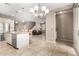 Open kitchen with stainless steel appliances, granite countertops, and a seamless view into the living area at 9144 W Surrey Dr, Peoria, AZ 85381