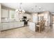 Spacious kitchen with stainless steel appliances, granite countertops, and a large island with seating at 9144 W Surrey Dr, Peoria, AZ 85381