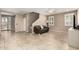 Spacious living room featuring tile flooring, neutral paint, and ample natural light at 9144 W Surrey Dr, Peoria, AZ 85381