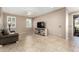 Living room featuring tile flooring, neutral paint, and a ceiling fan at 9144 W Surrey Dr, Peoria, AZ 85381