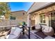 Cozy patio featuring comfortable seating, string lights and view of green window shutters at 9144 W Surrey Dr, Peoria, AZ 85381