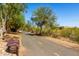 Picturesque walking trail with seating surrounded by desert landscape at 9144 W Surrey Dr, Peoria, AZ 85381