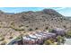 Aerial view of townhomes nestled near a mountain, showing the property's unique design and natural desert landscape at 9716 N 3Rd Dr, Phoenix, AZ 85021