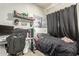 Functional bedroom featuring a black bed set, a gaming setup, and stylish decor to personalize the space at 9716 N 3Rd Dr, Phoenix, AZ 85021