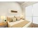 Bright bedroom with a large window, neutral decor, and a comfortable bed with decorative pillows at 9716 N 3Rd Dr, Phoenix, AZ 85021