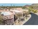 A charming, multi-unit dwelling featuring private garages and low-maintenance desert landscaping, and neutral paint palette at 9716 N 3Rd Dr, Phoenix, AZ 85021