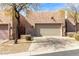 Charming home with a beige garage door, a front yard with desert landscaping and sunny skies above at 9716 N 3Rd Dr, Phoenix, AZ 85021