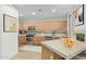 Well-lit kitchen with stainless steel appliances and lots of cabinet and counter space at 9716 N 3Rd Dr, Phoenix, AZ 85021