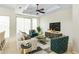 Stylish living room with lots of light, a ceiling fan, chic furniture and modern decor at 9716 N 3Rd Dr, Phoenix, AZ 85021