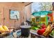 Cozy patio space with comfortable seating, barbecue, and unique decor, perfect for outdoor living at 9716 N 3Rd Dr, Phoenix, AZ 85021
