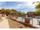 Community pool with metal fencing offers desert landscaping and mountain views from the building's common area at 9716 N 3Rd Dr, Phoenix, AZ 85021