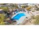 Aerial view of a fenced community pool with a spa, covered seating, and beautifully maintained desert landscaping at 9716 N 3Rd Dr, Phoenix, AZ 85021