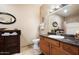 Bathroom featuring updated vanity and a well lit mirror at 10030 W Indian School Rd # 203, Phoenix, AZ 85037