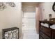 Bathroom with a shower and bath, including decorative accents at 10030 W Indian School Rd # 203, Phoenix, AZ 85037