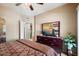 Well-lit bedroom with dresser and mirror, offering ample space at 10030 W Indian School Rd # 203, Phoenix, AZ 85037