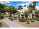 Manicured grounds with landscaping, walkway and view of pool area at 10030 W Indian School Rd # 203, Phoenix, AZ 85037