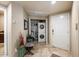 Convenient laundry area with a stacked washer and dryer unit and tile flooring at 10030 W Indian School Rd # 203, Phoenix, AZ 85037
