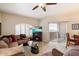 Comfortable living room featuring a plush sofa, fireplace, and sliding doors to a patio at 10030 W Indian School Rd # 203, Phoenix, AZ 85037