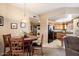 Open concept living space with dining area featuring appliances and great natural light at 10030 W Indian School Rd # 203, Phoenix, AZ 85037