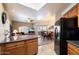 Open-concept living space with kitchen, dining area, and living room, great for entertaining at 10030 W Indian School Rd # 203, Phoenix, AZ 85037