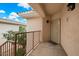Cozy outdoor porch area with a secure door and railing that enhances the property's appeal at 10030 W Indian School Rd # 203, Phoenix, AZ 85037