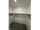 Spacious walk-in closet with shelving and carpet at 10035 S 23Rd Dr, Phoenix, AZ 85041