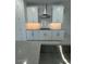 Bright kitchen featuring white cabinets, gray counters, and stainless steel appliances at 10035 S 23Rd Dr, Phoenix, AZ 85041