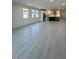 Open floor plan showcasing natural lighting and tile flooring with an open kitchen concept at 10035 S 23Rd Dr, Phoenix, AZ 85041