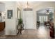 Inviting foyer with tiled floors, decor table, and views into the formal dining and living areas at 10039 E Emerald Dr, Sun Lakes, AZ 85248