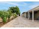 Large backyard featuring a covered patio, storage shed, and brick flooring at 10713 N 36Th Ave, Phoenix, AZ 85029
