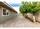 Private backyard featuring mature trees, a patio, and a home exterior at 10713 N 36Th Ave, Phoenix, AZ 85029