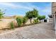 Spacious backyard with mature trees and a brick patio, perfect for entertaining or relaxing at 10713 N 36Th Ave, Phoenix, AZ 85029