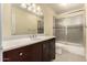 Bathroom with a shower, toilet, vanity and decorative mirror at 10713 N 36Th Ave, Phoenix, AZ 85029