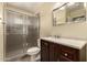 Bathroom with a shower, toilet, vanity and decorative mirror at 10713 N 36Th Ave, Phoenix, AZ 85029