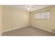 Bedroom featuring tile flooring, a ceiling fan, and a window at 10713 N 36Th Ave, Phoenix, AZ 85029