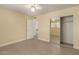 Bedroom showing tile flooring, closet, and entry door at 10713 N 36Th Ave, Phoenix, AZ 85029