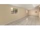 Large bonus room with light walls and neutral tile flooring at 10713 N 36Th Ave, Phoenix, AZ 85029