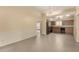 View of the dining area flowing into the kitchen and featuring gray tile flooring at 10713 N 36Th Ave, Phoenix, AZ 85029